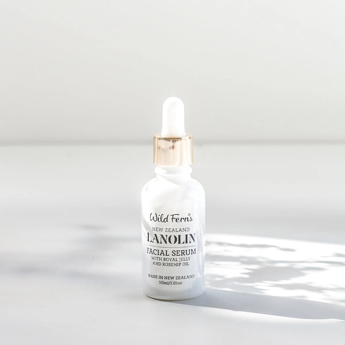 Bottle of Wild Ferns Lanolin Facial Serum on a white background
