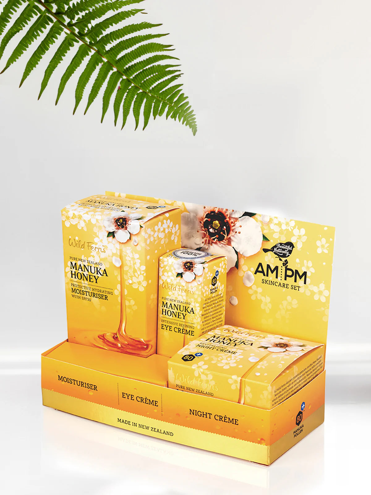 Wild Fern's Manuka Honey AM/PM skincare set packaging with a fern leaf on a light background