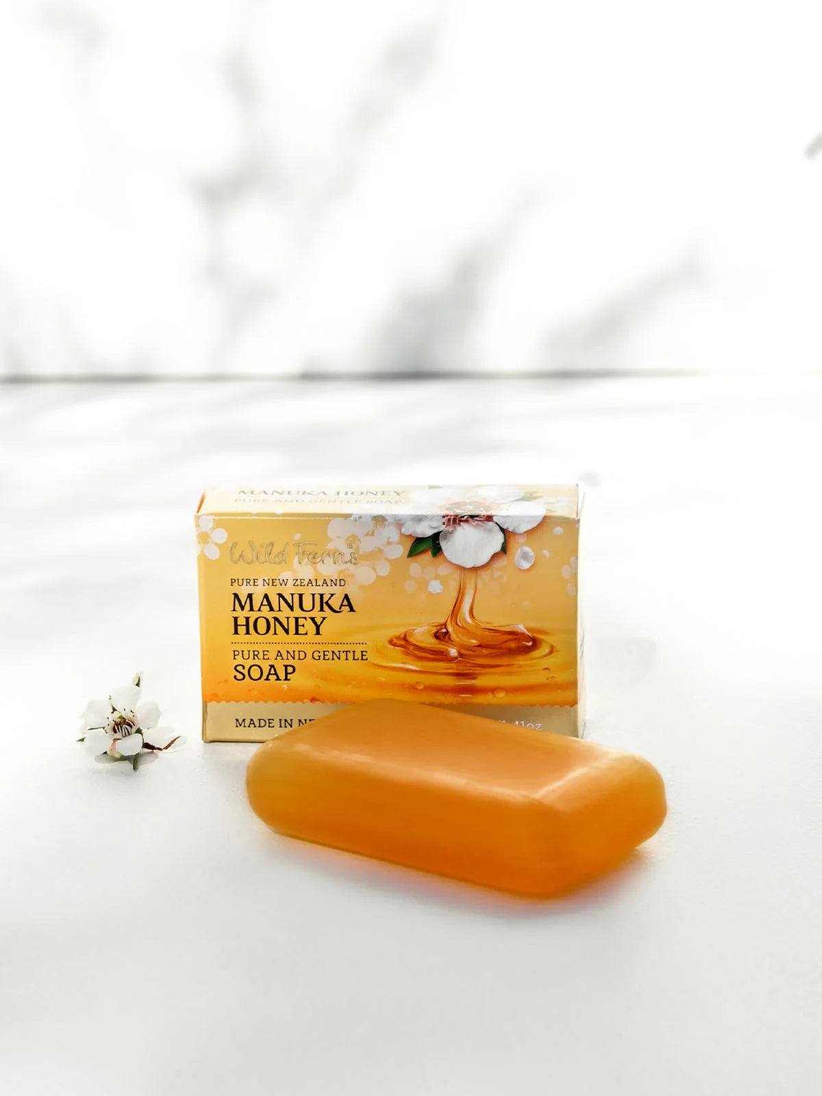Wild Fern's pure and gentle manuka honey soap on a white surface