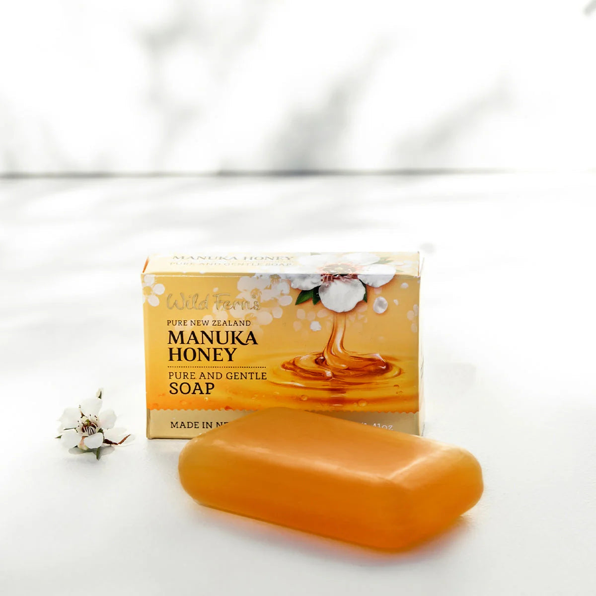 Wild Fern's pure and gentle manuka honey soap on a white surface