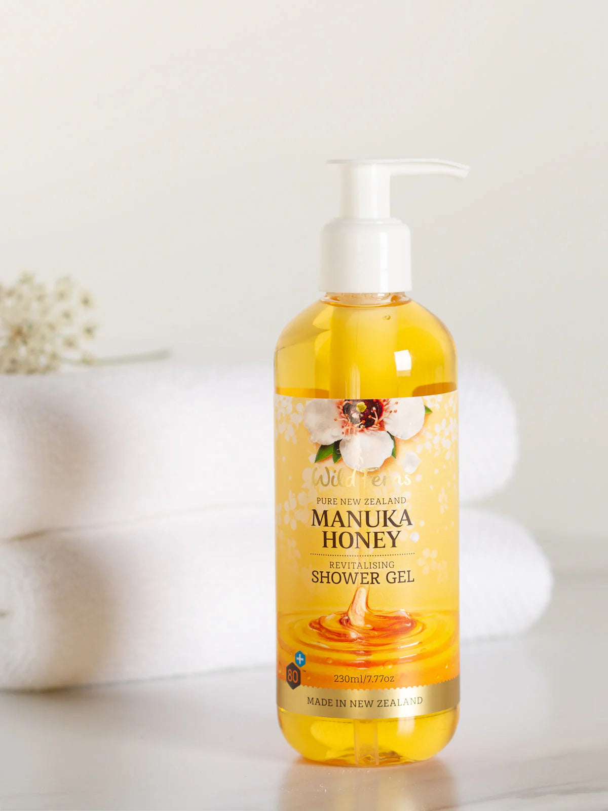 Manuka Honey shower gel bottle on a white background