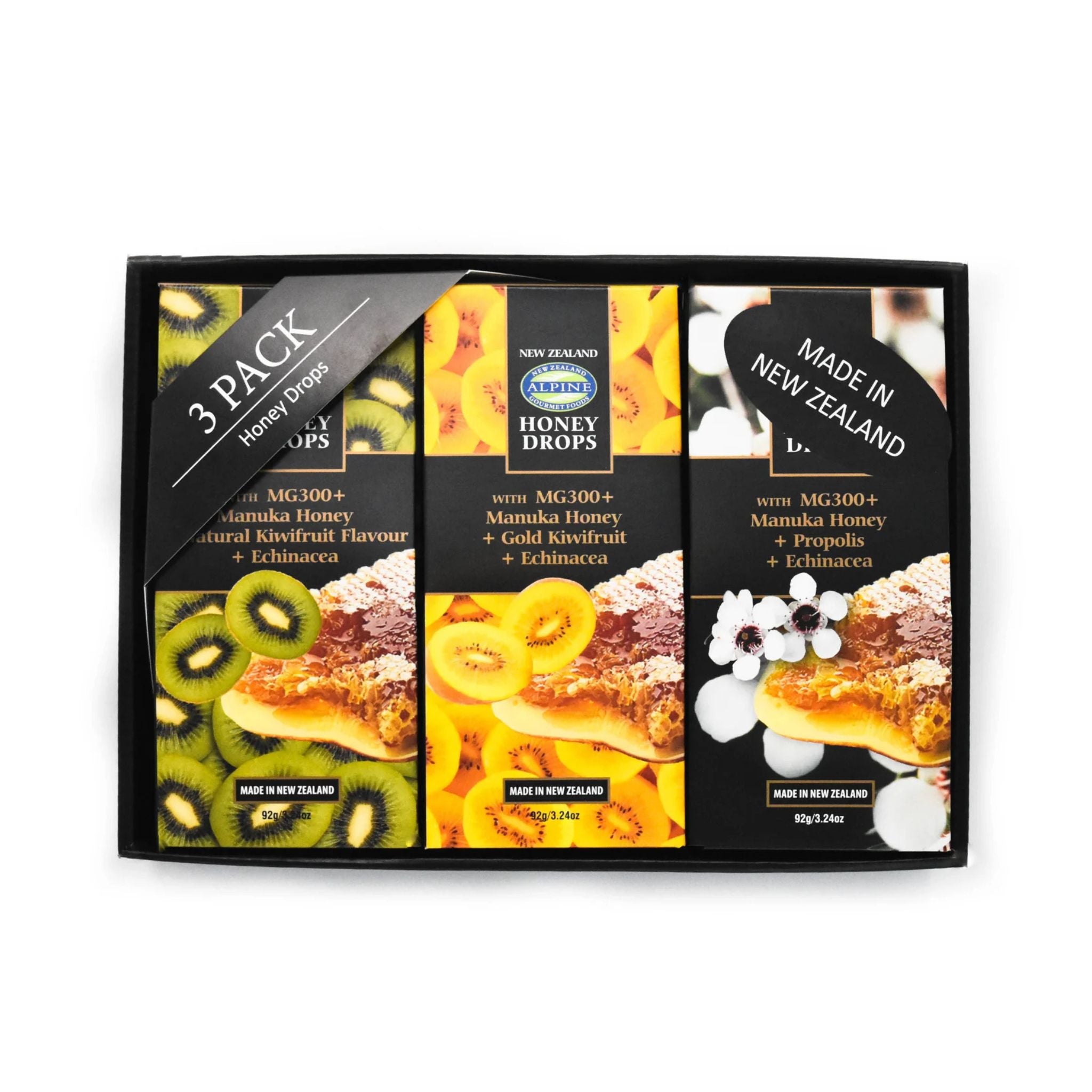 A 3-pack box of Honey Drops by New Zealand Honey Drops, featuring three distinct flavors (Kiwi, Mamuka Honey, and Mamuka Honey with Propolis) in black packaging with colorful fruit and pastry illustrations.