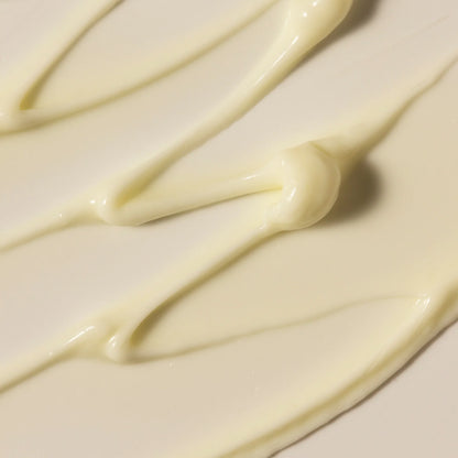 Close-up of smooth, Antipodes white Grace cream  on a light background