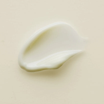 Close-up of a smooth, light-colored cream of Antipodes kiwi seed oil