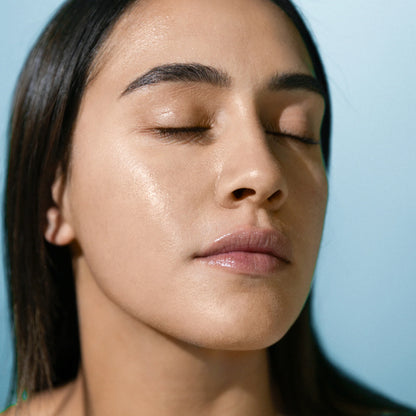 A lady with Antipodes Supernatural SPF50+ on her face