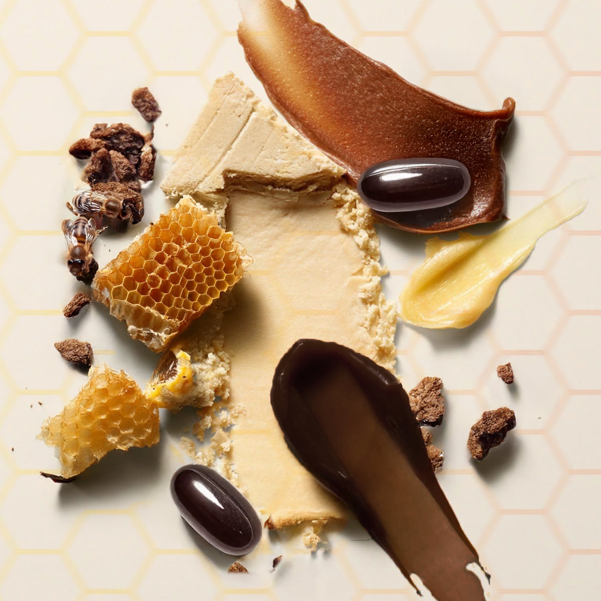 Assorted Avoca bee propolis including honeycomb, honey drips, and honeycombs on a light background
