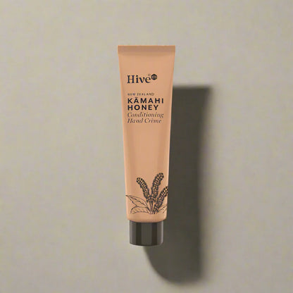 Tube of Hive Kamahi Honey Conditioning Hand Creme on a beige background