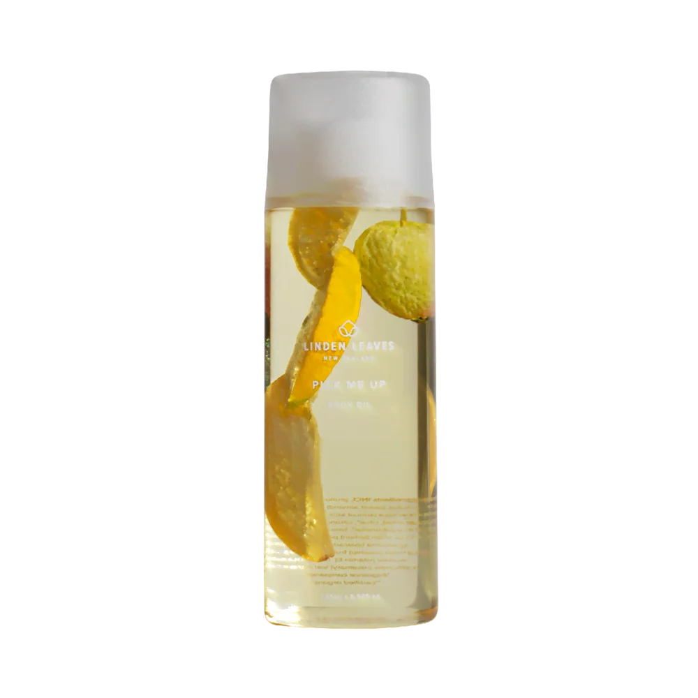 Linden Leaves Pick Me Up Body Oil bottle with fruit 