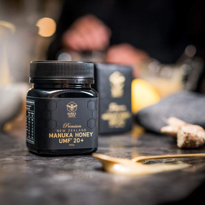 Manuka South Manuka South UMF 20+ 250g jar on  black table with spoon