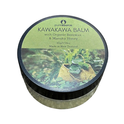 A round tin of Puresource Kawakawa Balm with a green and black lid featuring a natural forest illustration, set against a plain white background.