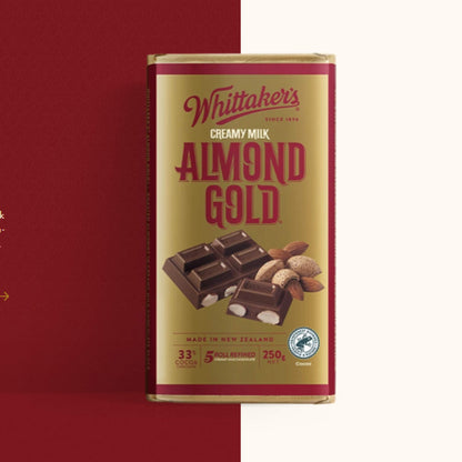 Whittaker's Almond Gold chocolate bar packaging on a red background
