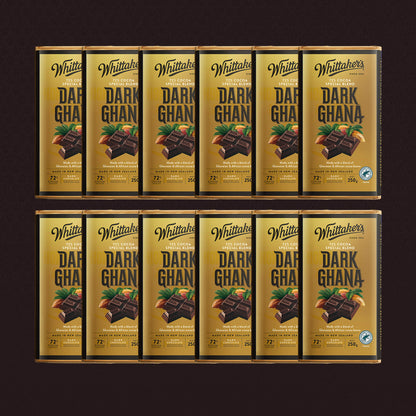 Multiple boxes of Whittaker's Dark Ghana chocolate on a dark background
