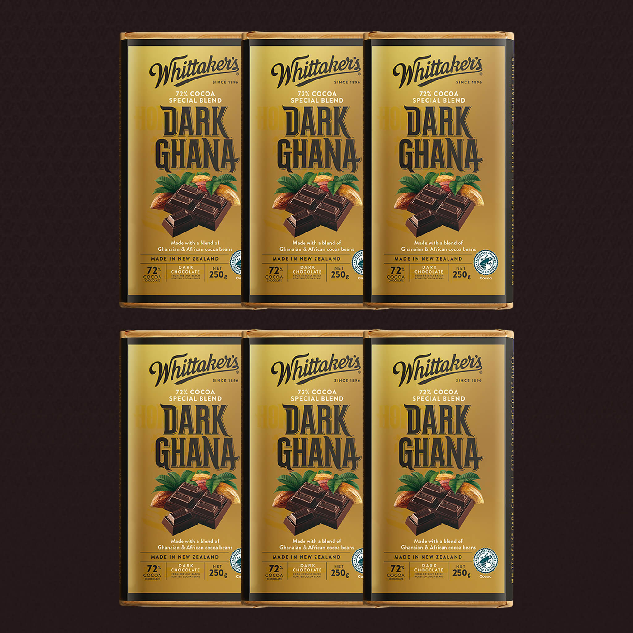 Six packages of Whittaker's Dark Ghana chocolate bars on a dark background