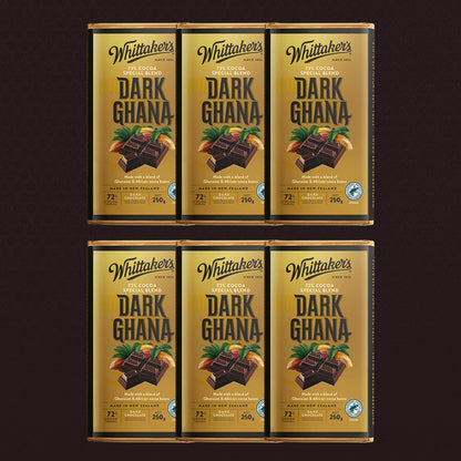 Six packages of Whittaker's Dark Ghana chocolate bars on a dark background