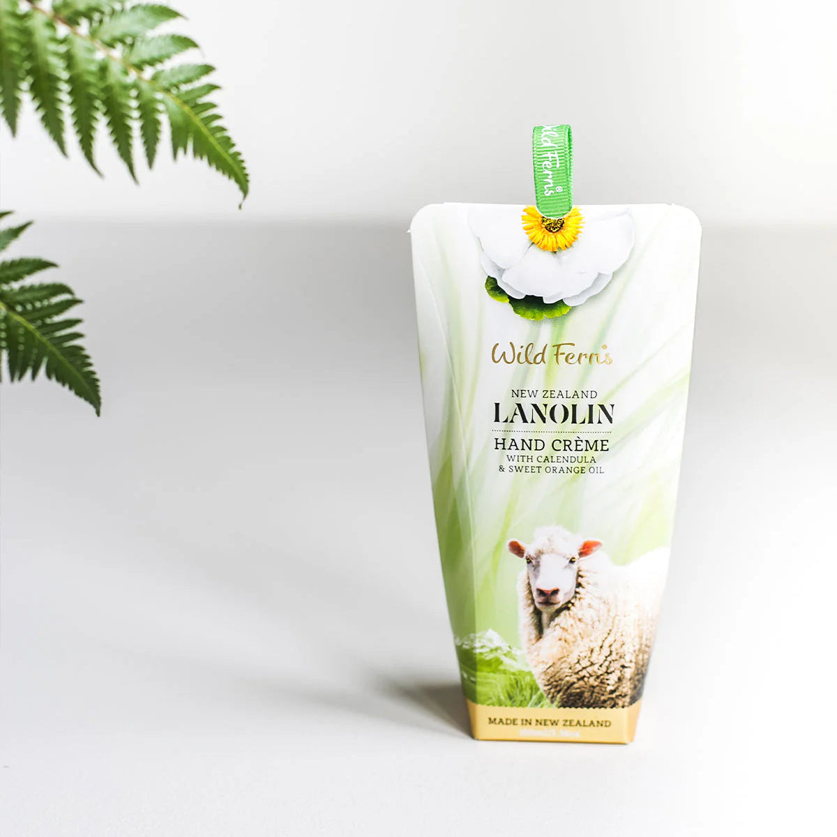 Wild Fern's Lanolin Hand cream packaging with a sheep illustration on a white background