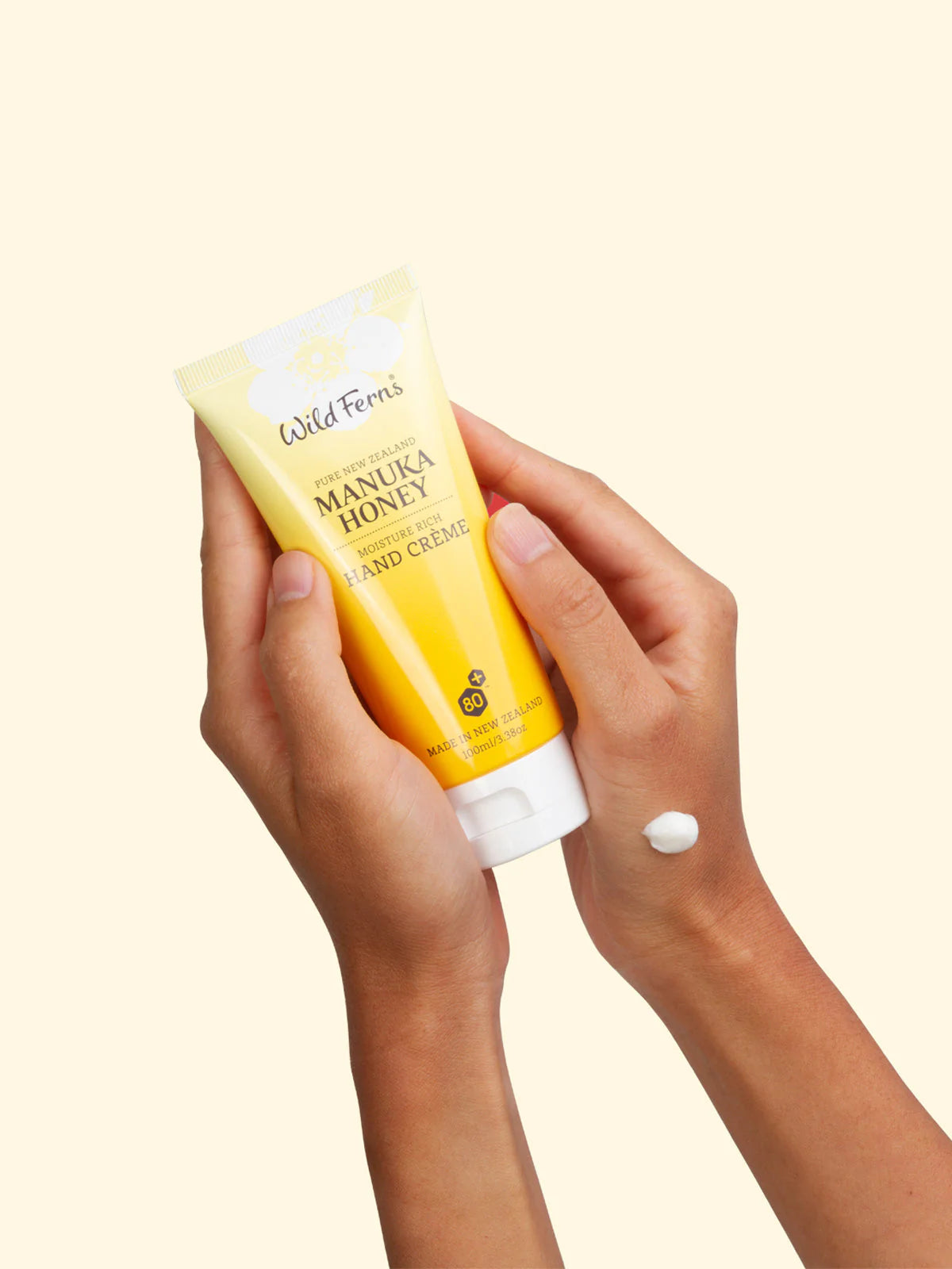 Wild Wern's manuka honey moisture rich hand cream held by hands