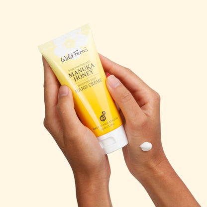 Wild Wern's manuka honey moisture rich hand cream held by hands