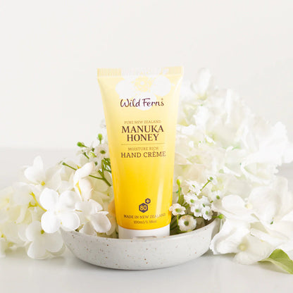 Wild Wern's manuka honey moisture rich hand cream on a white dish with flower