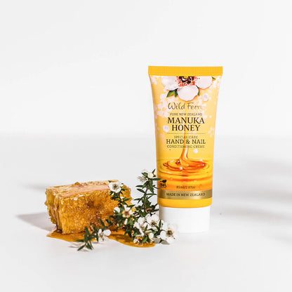 Wild Ferns Manuka Honey Hand and Nail Creme with honeycomb and flowers on a white background