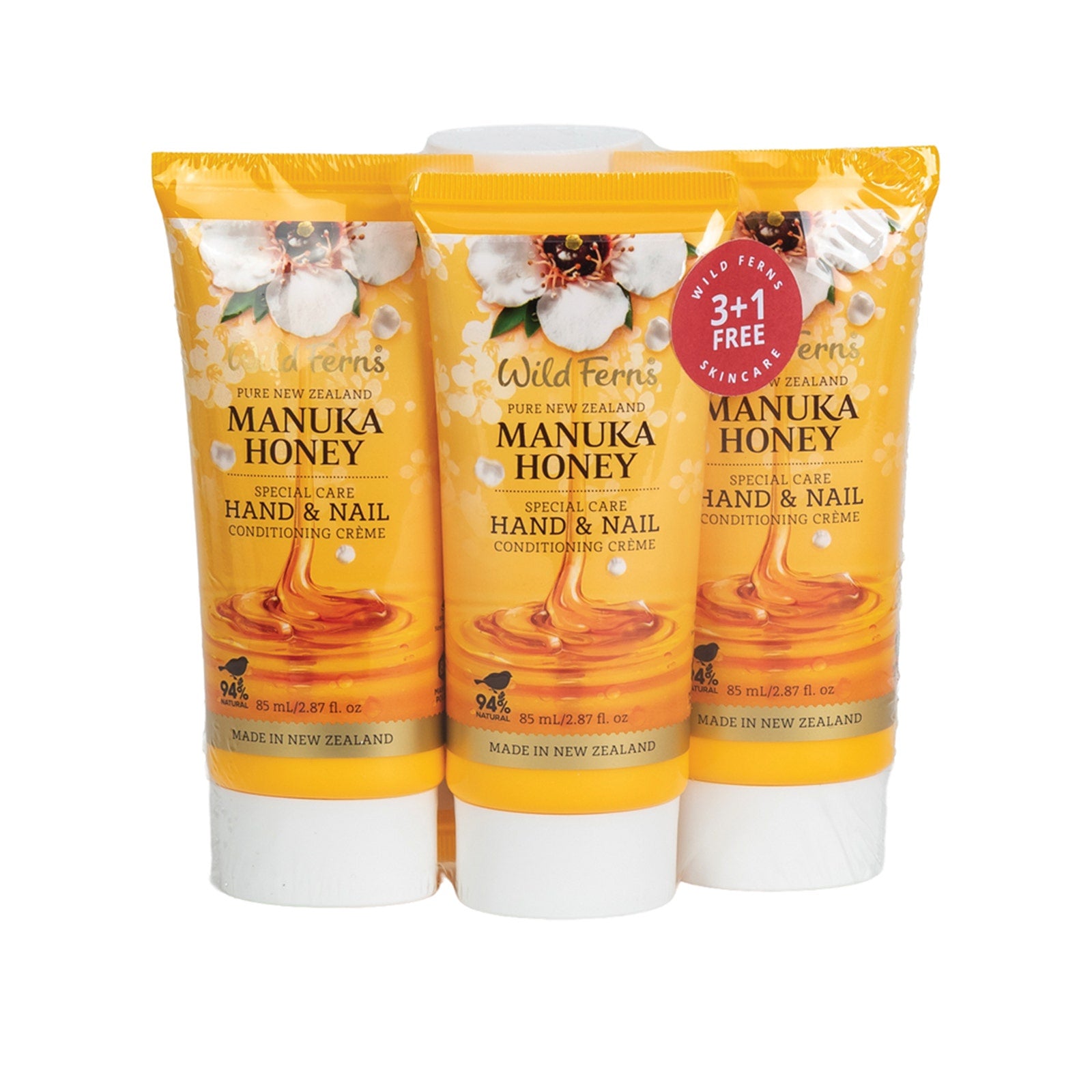 Three bottles of Wild Ferns Manuka Honey hand and nail cream on a white background