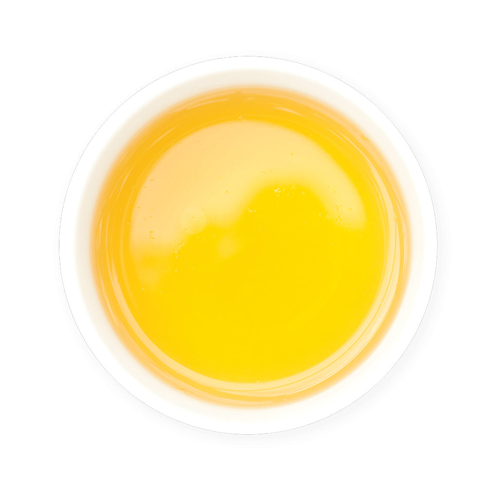 Yellow Zealong Organic Oolong Tea in a white bowl on a white background
