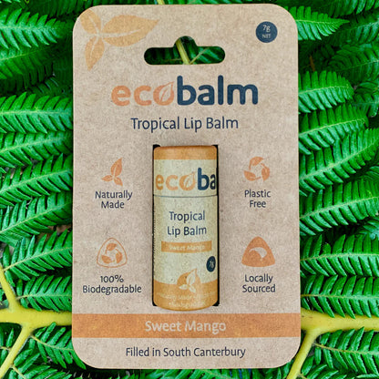 ecobase ecobalm tropical lip balm packaging on a green leaf background